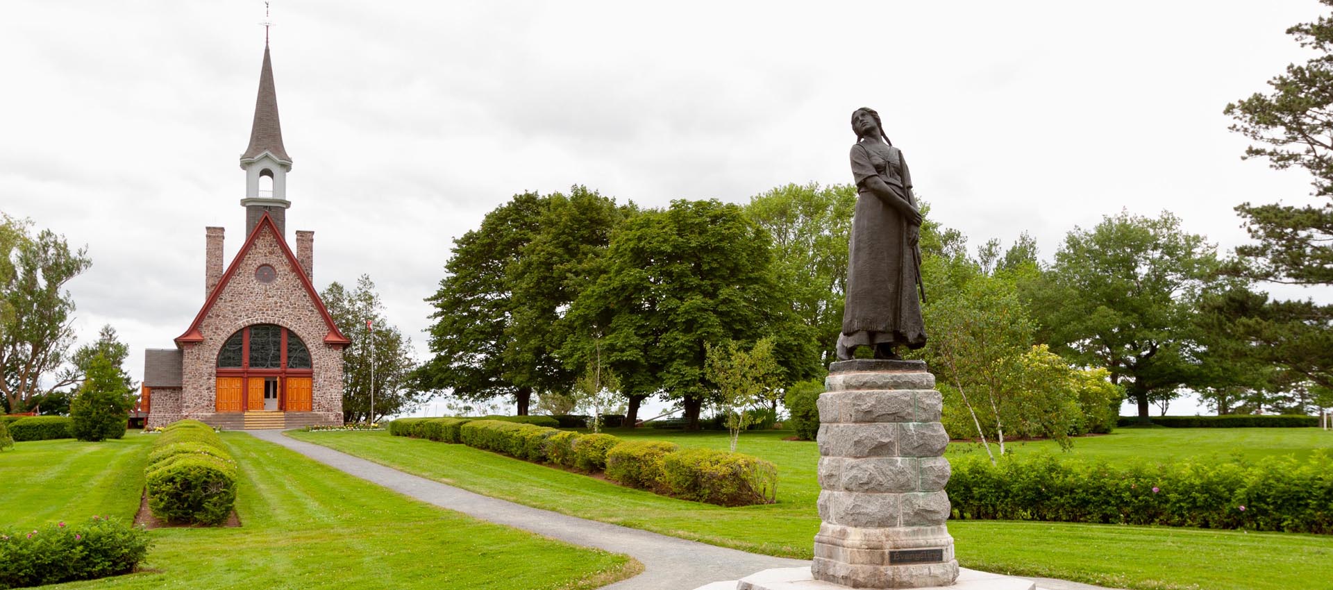 The statue of Evangeline and the church at Grand Pr&eacute; National Historic Site, near Wolfville, Nova Scotia